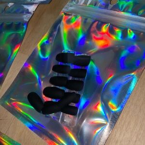 Chic Black Nail Tips with Holographic Pouch